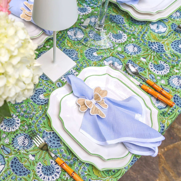 Table setting on green block printed tablecloth